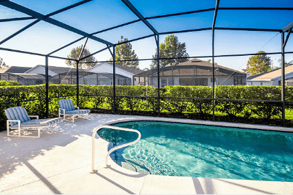 Image of clear pool surrounded by screen enclosure in florida